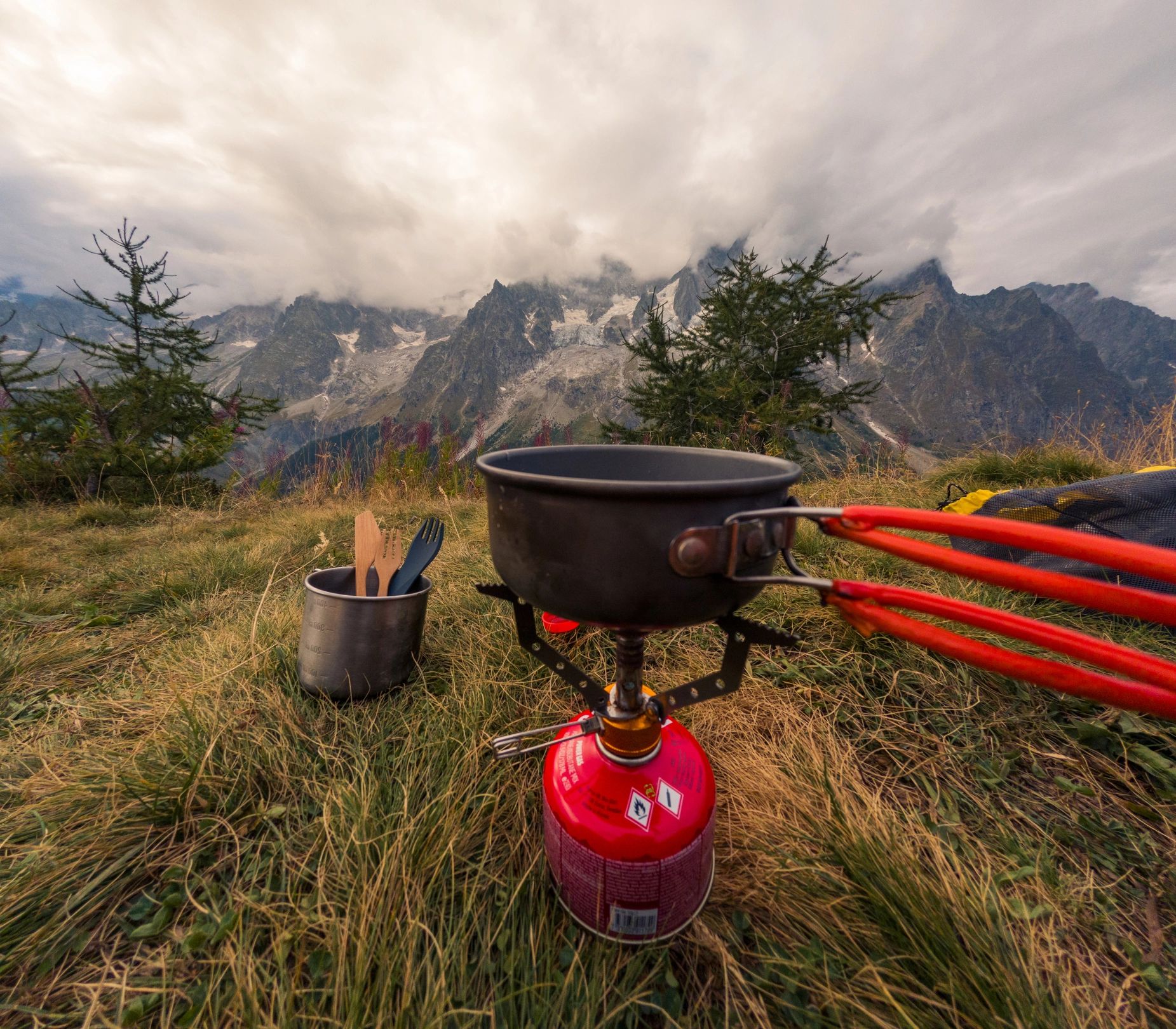 Portable camping stove with scenic mountain view