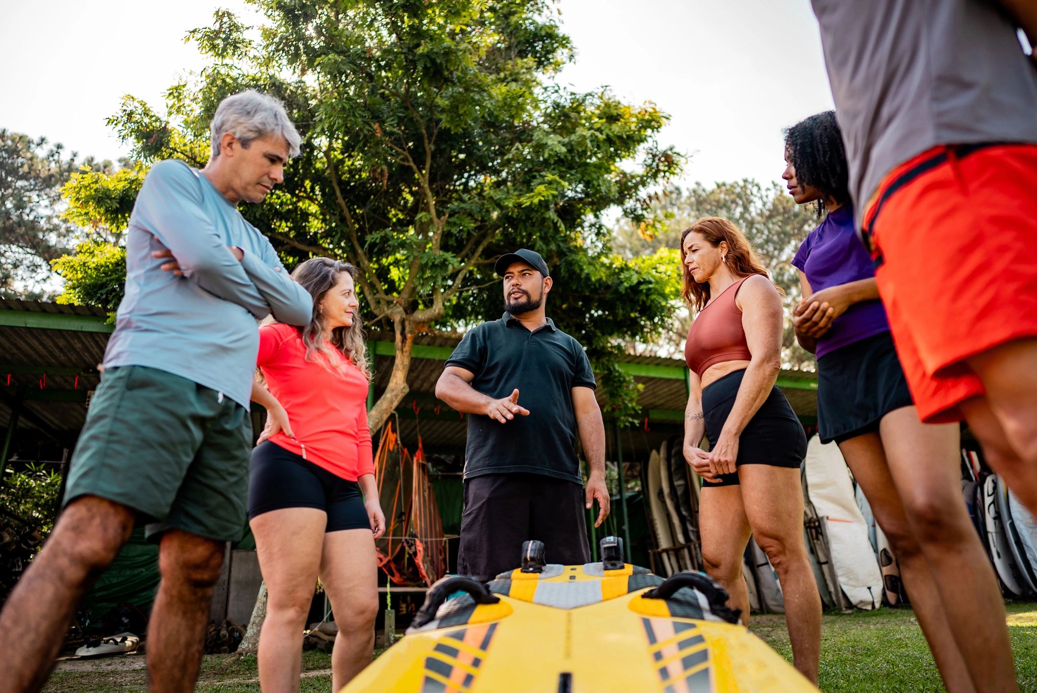 Outdoor instructor speaking to a group in a rugged setting